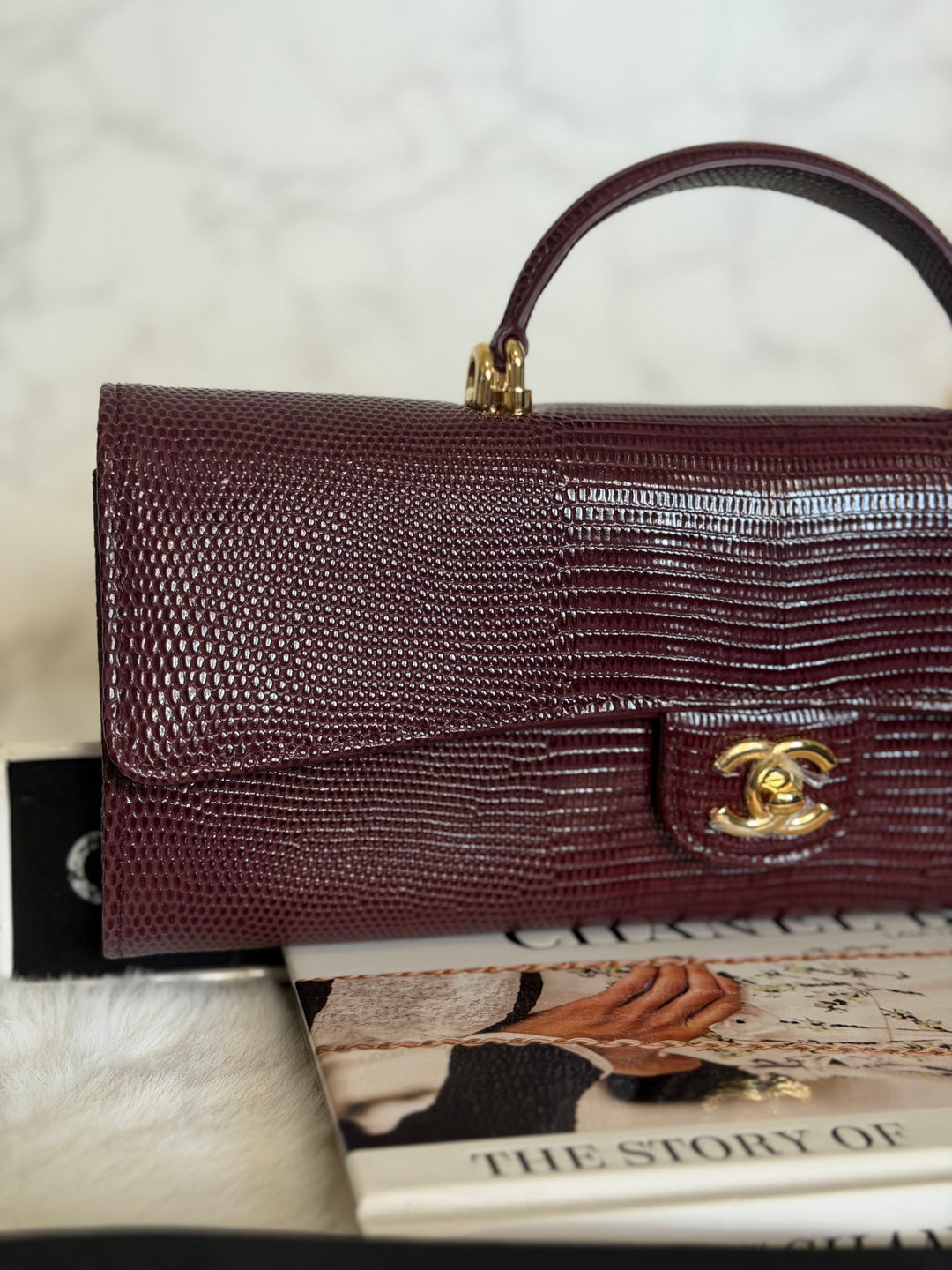 CHANEL 26A Matthieu Blazy Clutch with Top Handle in Burgundy Lizard-Embossed Calfskin with Light Gold Hardware 2026