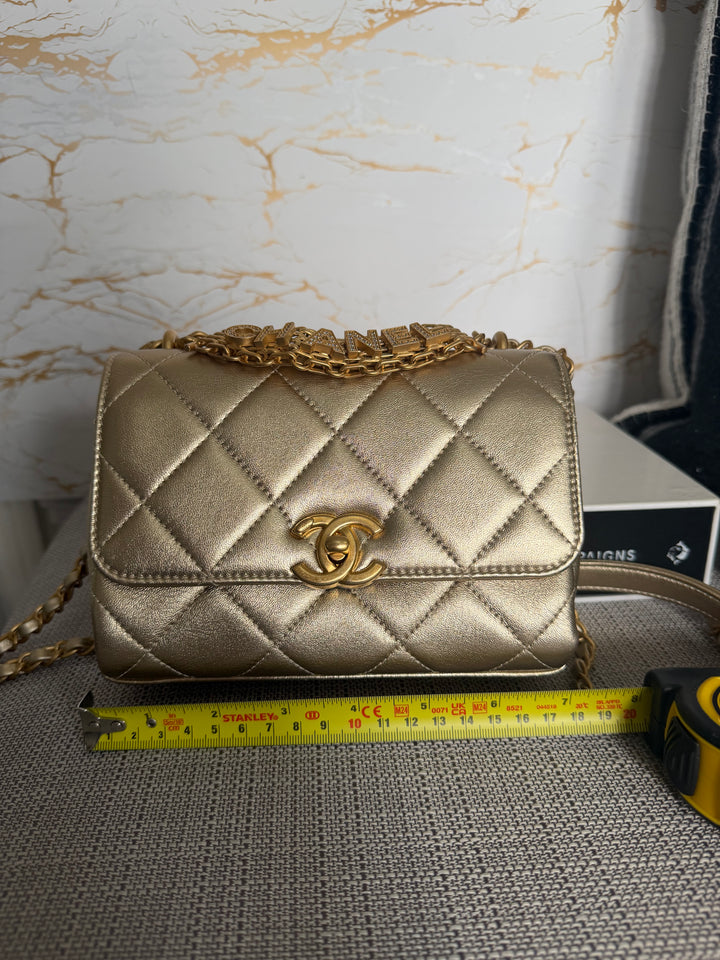 CHANEL Gold Metallic Lambskin CC Crystal Logo Chain Flap Bag 2022