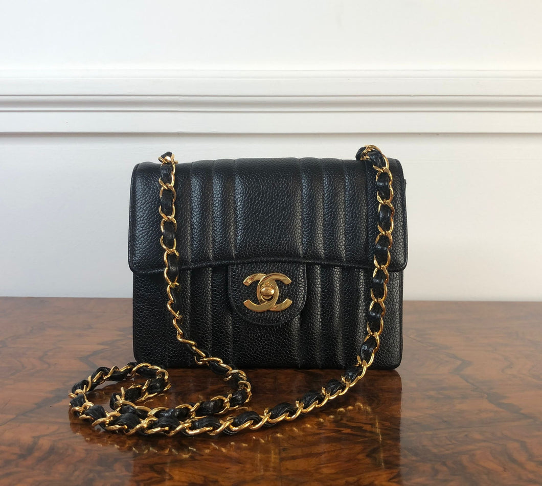 Chanel series 2 Black Caviar 24K GHW Vintage Mademoiselle Mini Flap Bag