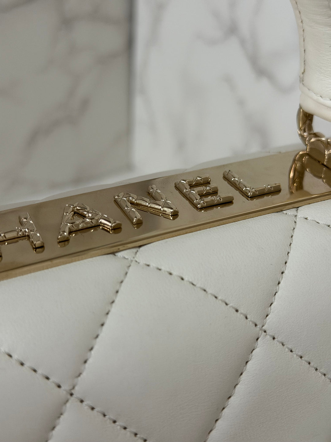 CHANEL 23S collection 2023 White Lambskin LGHW Trendy CC Flap Bag size Small with raised CHANEL Engraved Plate Top Handle