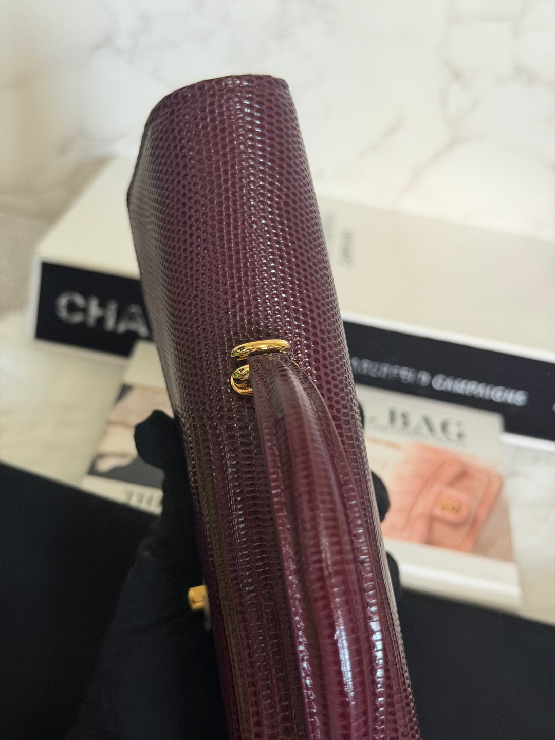 CHANEL 26A Matthieu Blazy Clutch with Top Handle in Burgundy Lizard-Embossed Calfskin with Light Gold Hardware 2026