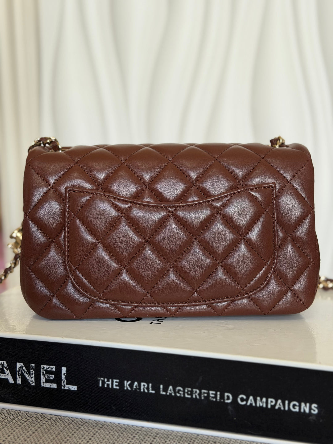 CHANEL 26S Brown Lambskin Adjustable Chain LGHW Mini Rectangular Flap Bag 2026