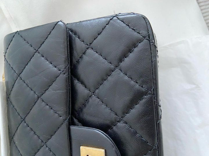 Chanel series 28 (2019) Black Calf skin Aged GHW Mini Reissue Flap Bag