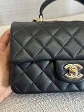 Load image into Gallery viewer, Chanel Black Lambskin Mini Rectangular Flap Bag with Top Handle and Champagne GHW
