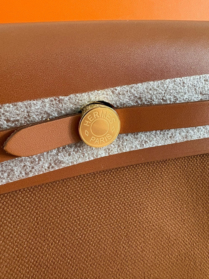 Hermès Gold Vache Hunter and Toile Mini Herbag Zip 20 Gold Hardware, 2026