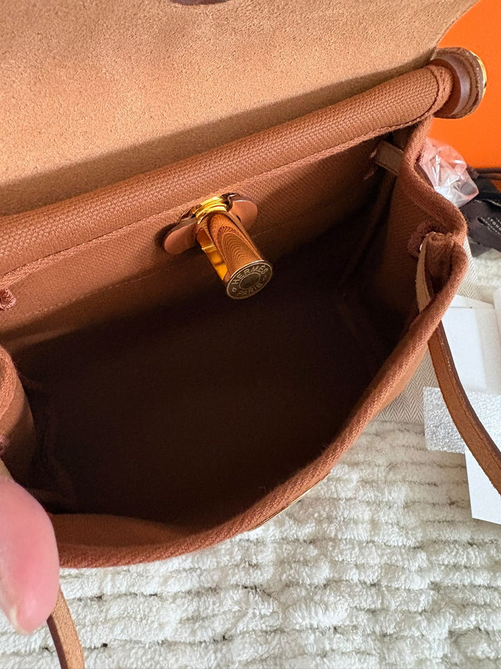 Hermès Gold Vache Hunter and Toile Mini Herbag Zip 20 Gold Hardware, 2026