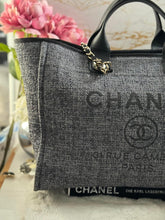 Load image into Gallery viewer, Chanel 2021 Deauville tote in Black interwoven raffia like material with LGHW in size Medium Tote Bag (15 inches)
