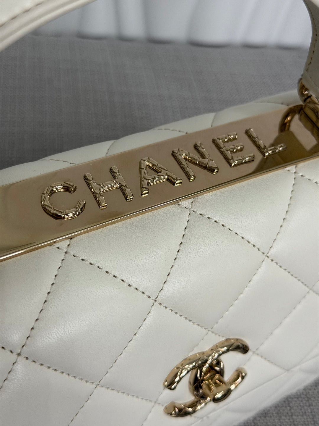 CHANEL 23S collection 2023 White Lambskin LGHW Trendy CC Flap Bag size Small with raised CHANEL Engraved Plate Top Handle