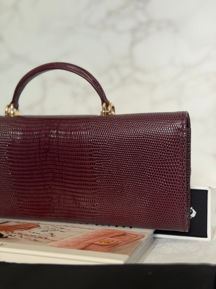 CHANEL 26A Matthieu Blazy Clutch with Top Handle in Burgundy Lizard-Embossed Calfskin with Light Gold Hardware 2026