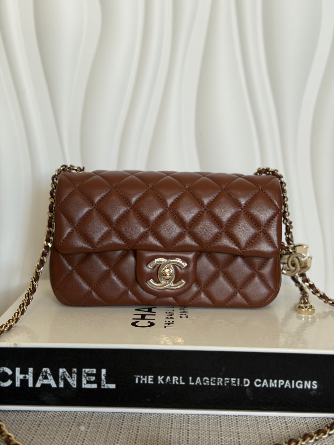 CHANEL 26S Brown Lambskin Adjustable Chain LGHW Mini Rectangular Flap Bag 2026