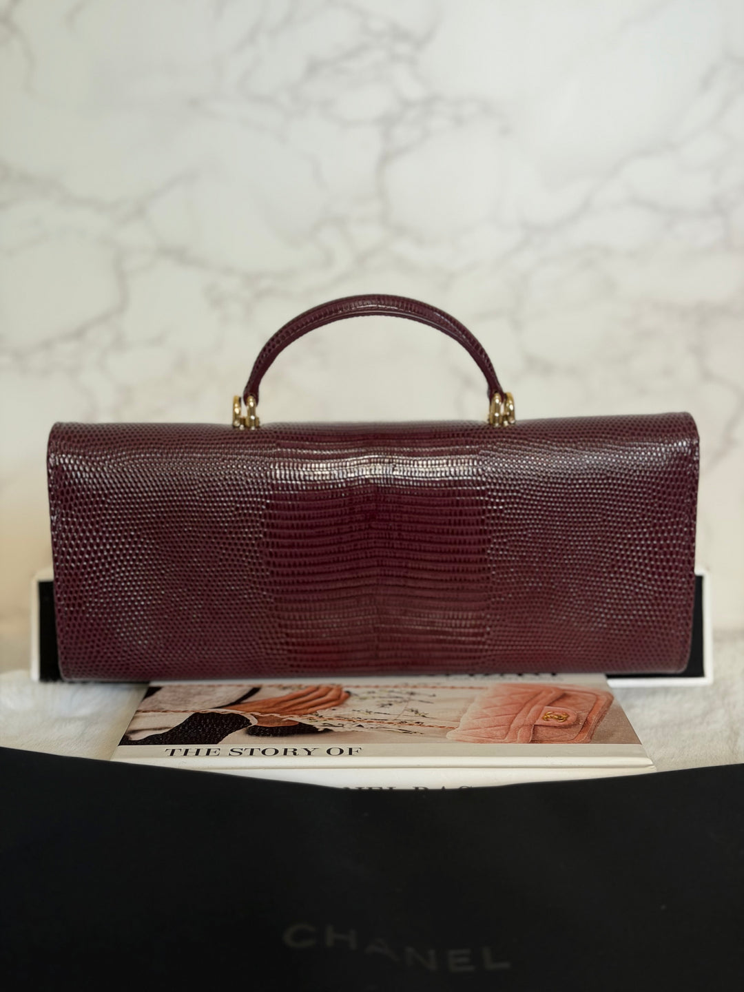 CHANEL 26A Matthieu Blazy Clutch with Top Handle in Burgundy Lizard-Embossed Calfskin with Light Gold Hardware 2026