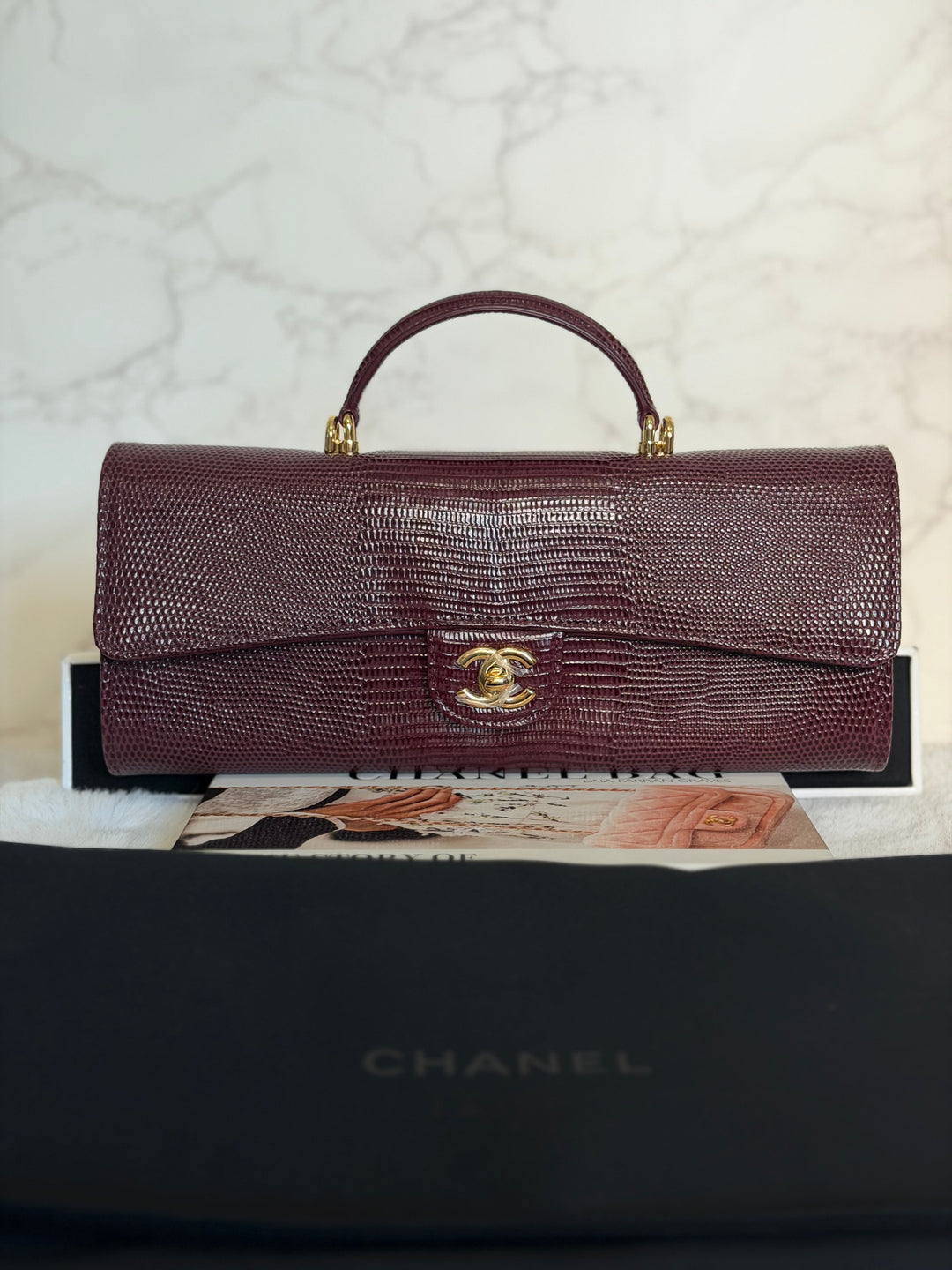 CHANEL 26A Matthieu Blazy Clutch with Top Handle in Burgundy Lizard-Embossed Calfskin with Light Gold Hardware 2026