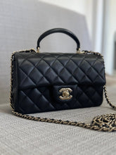 Load image into Gallery viewer, Chanel Black Lambskin Mini Rectangular Flap Bag with Top Handle and Champagne GHW
