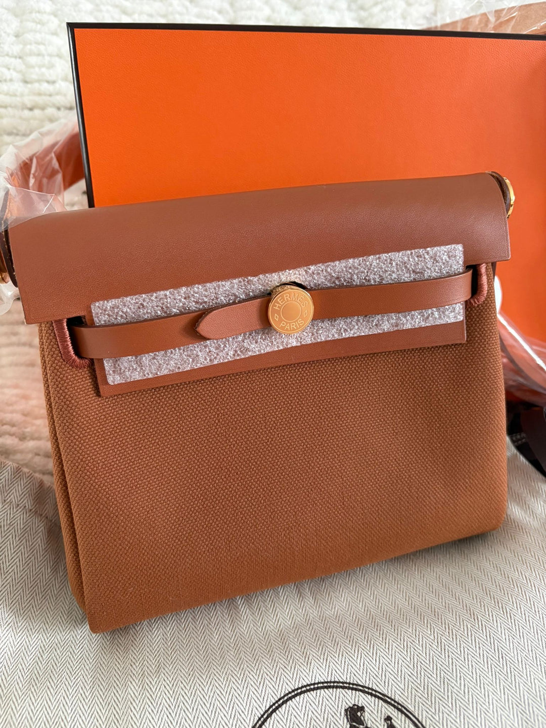 Hermès Gold Vache Hunter and Toile Mini Herbag Zip 20 Gold Hardware, 2026