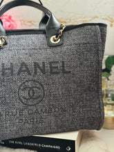 Load image into Gallery viewer, Chanel 2021 Deauville tote in Black interwoven raffia like material with LGHW in size Medium Tote Bag (15 inches)
