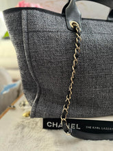 Load image into Gallery viewer, Chanel 2021 Deauville tote in Black interwoven raffia like material with LGHW in size Medium Tote Bag (15 inches)
