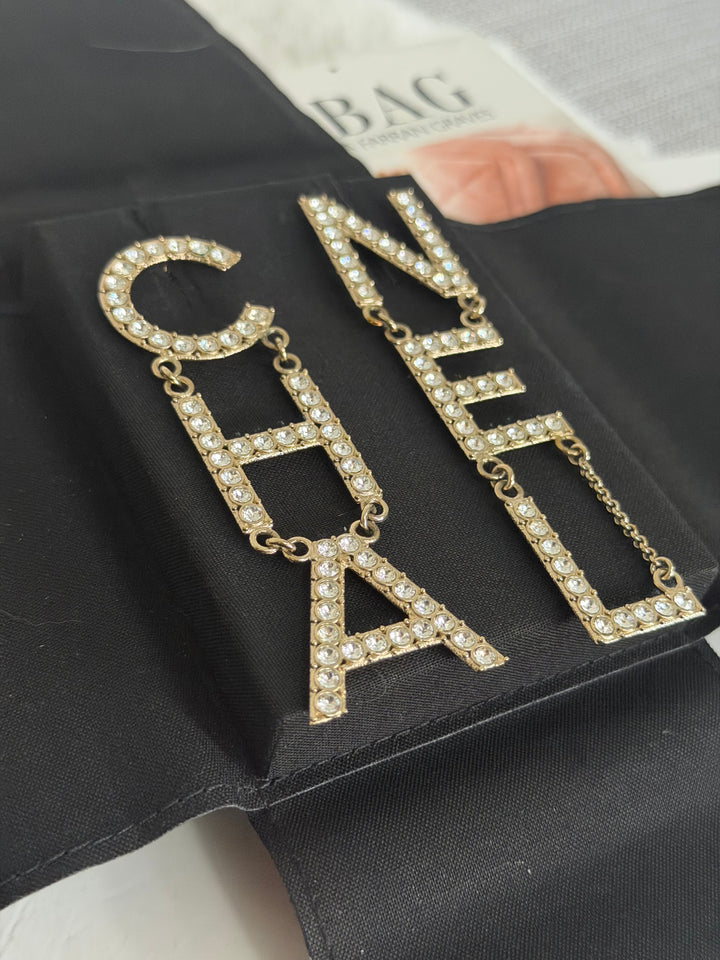 CHANEL Diamanté Letter Statement Earrings in Gold and Crystals