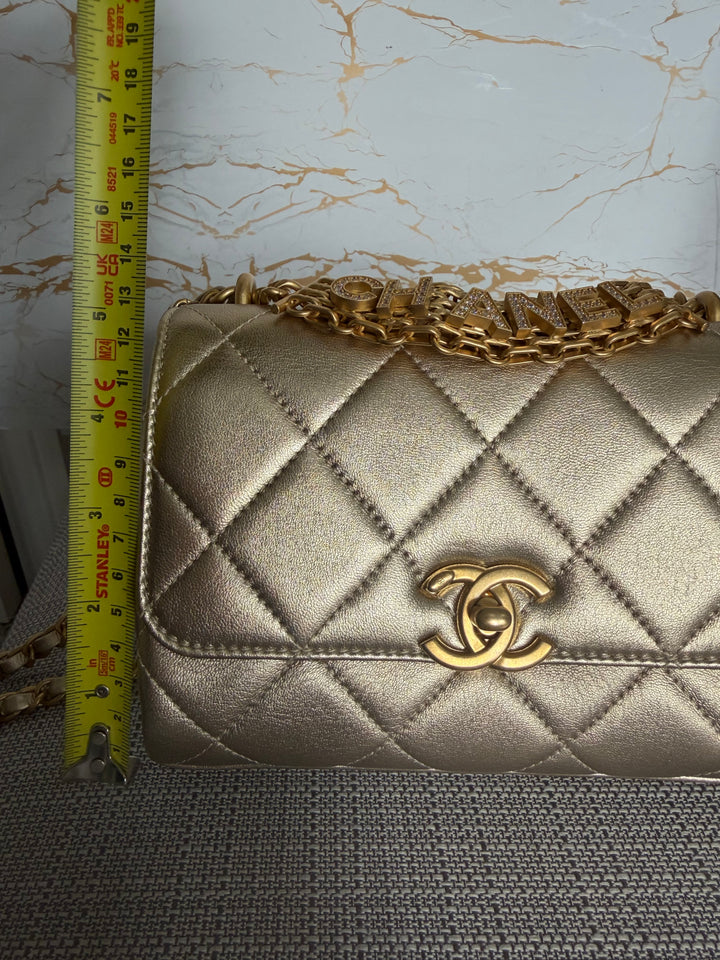 CHANEL Gold Metallic Lambskin CC Crystal Logo Chain Flap Bag 2022
