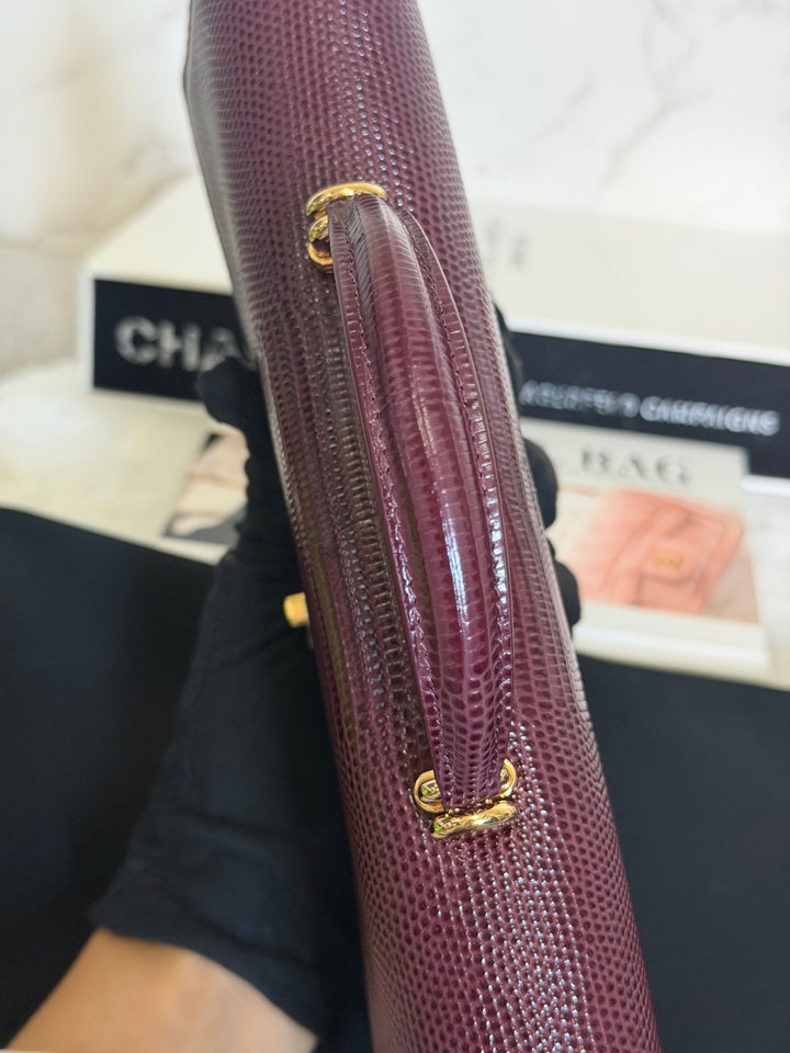 CHANEL 26A Matthieu Blazy Clutch with Top Handle in Burgundy Lizard-Embossed Calfskin with Light Gold Hardware 2026