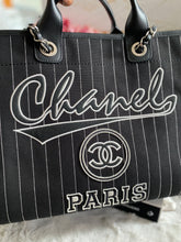 Load image into Gallery viewer, Chanel 23P 2023 Pre Spring/Summer collection in Black/White Stripe Canvas Deauville Tote with Top Handle and detachable pouch size Medium (15 inches)
