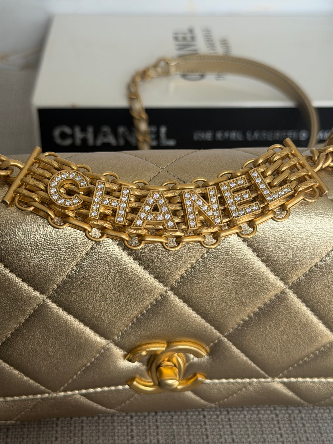 CHANEL Gold Metallic Lambskin CC Crystal Logo Chain Flap Bag 2022