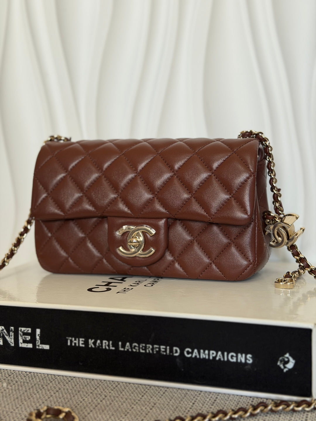 CHANEL 26S Brown Lambskin Adjustable Chain LGHW Mini Rectangular Flap Bag 2026