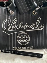 Load image into Gallery viewer, Chanel 23P 2023 Pre Spring/Summer collection in Black/White Stripe Canvas Deauville Tote with Top Handle and detachable pouch size Medium (15 inches)
