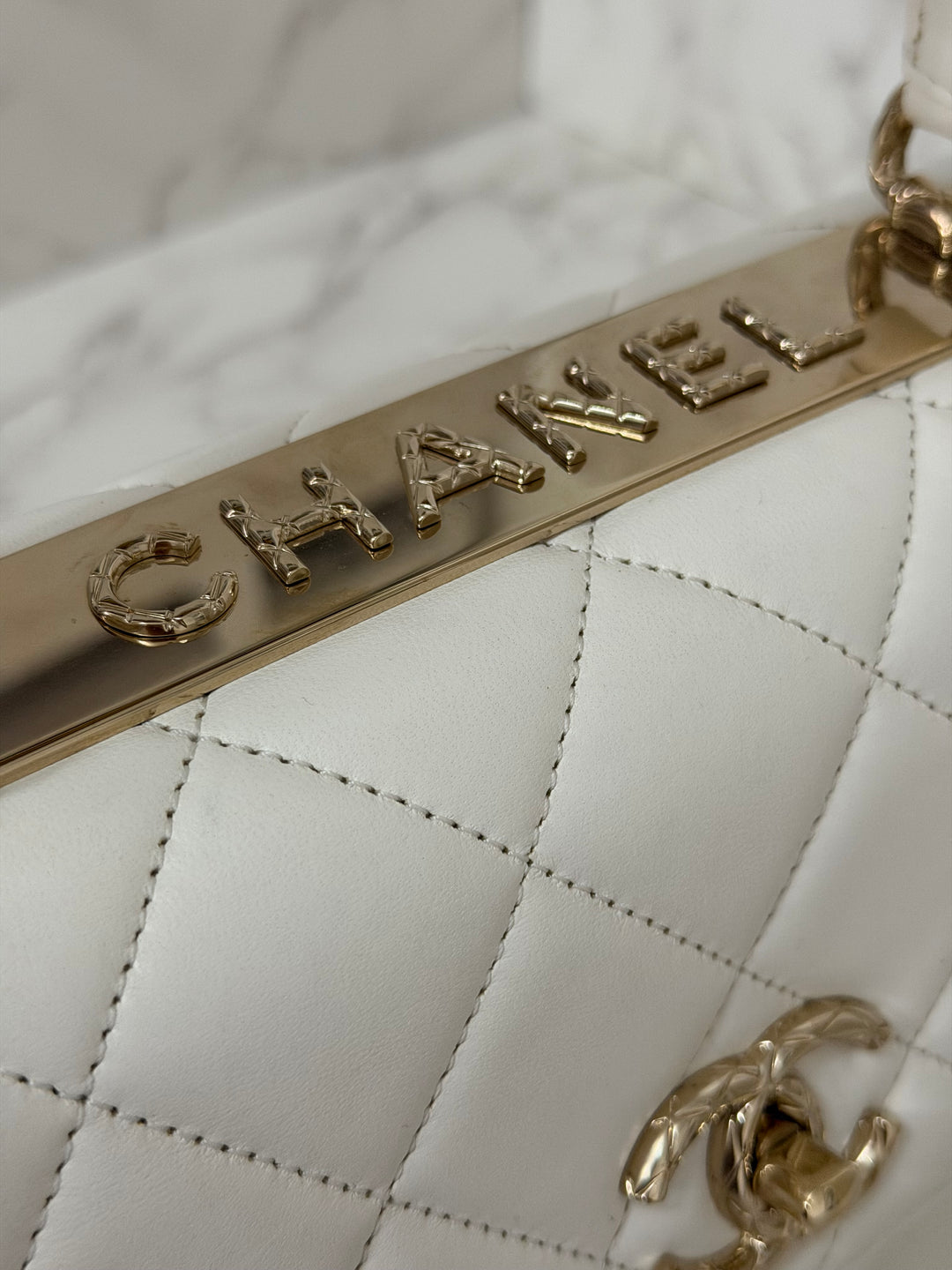 CHANEL 23S collection 2023 White Lambskin LGHW Trendy CC Flap Bag size Small with raised CHANEL Engraved Plate Top Handle