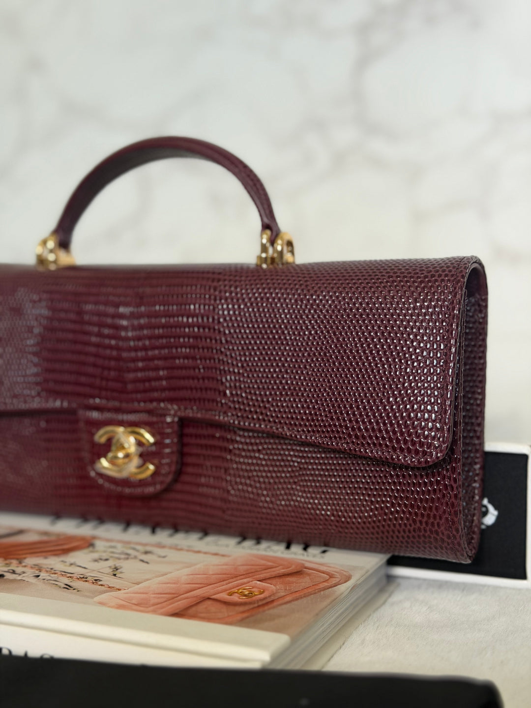 CHANEL 26A Matthieu Blazy Clutch with Top Handle in Burgundy Lizard-Embossed Calfskin with Light Gold Hardware 2026