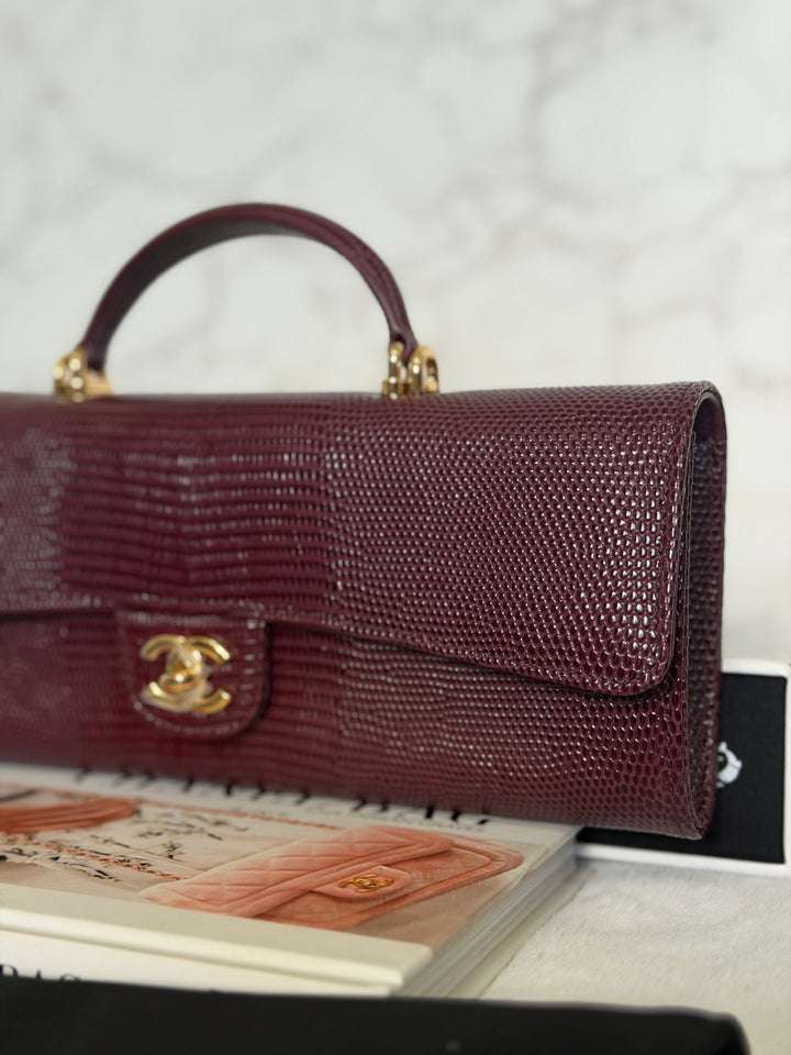 CHANEL 26A Matthieu Blazy Clutch with Top Handle in Burgundy Lizard-Embossed Calfskin with Light Gold Hardware 2026