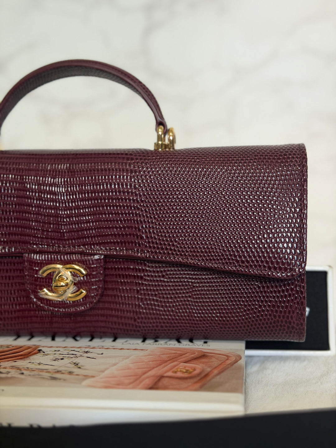 CHANEL 26A Matthieu Blazy Clutch with Top Handle in Burgundy Lizard-Embossed Calfskin with Light Gold Hardware 2026