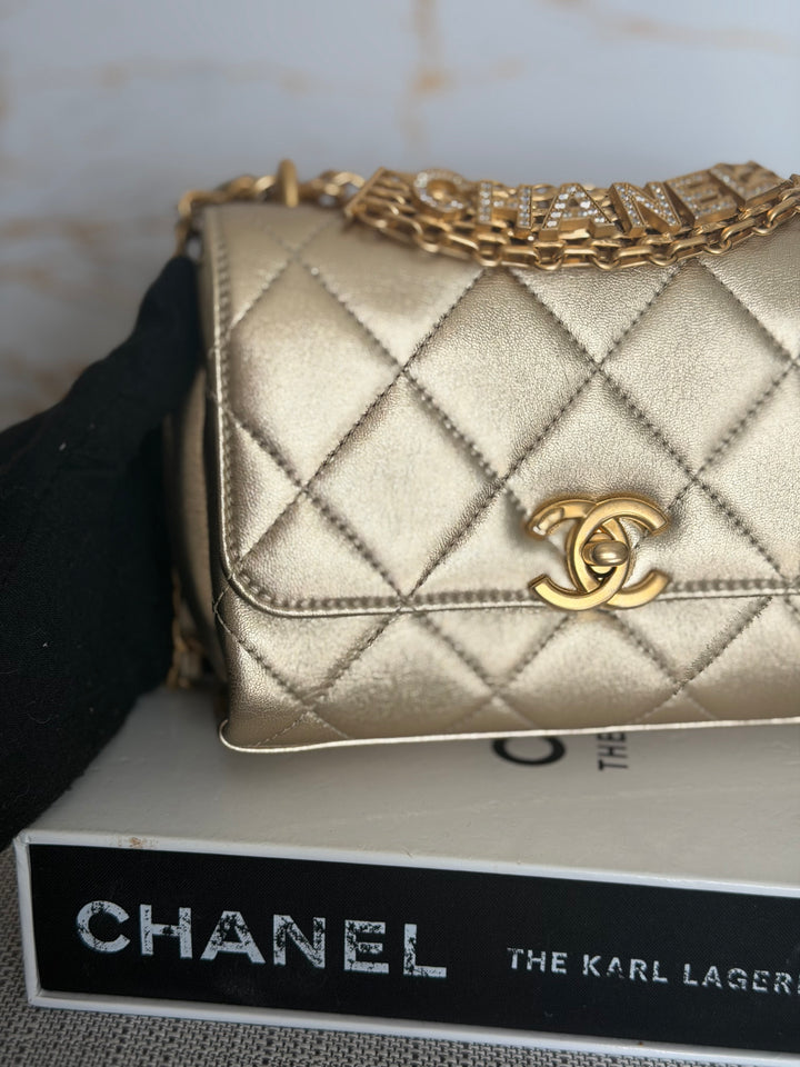 CHANEL Gold Metallic Lambskin CC Crystal Logo Chain Flap Bag 2022