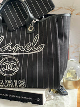 Load image into Gallery viewer, Chanel 23P 2023 Pre Spring/Summer collection in Black/White Stripe Canvas Deauville Tote with Top Handle and detachable pouch size Medium (15 inches)
