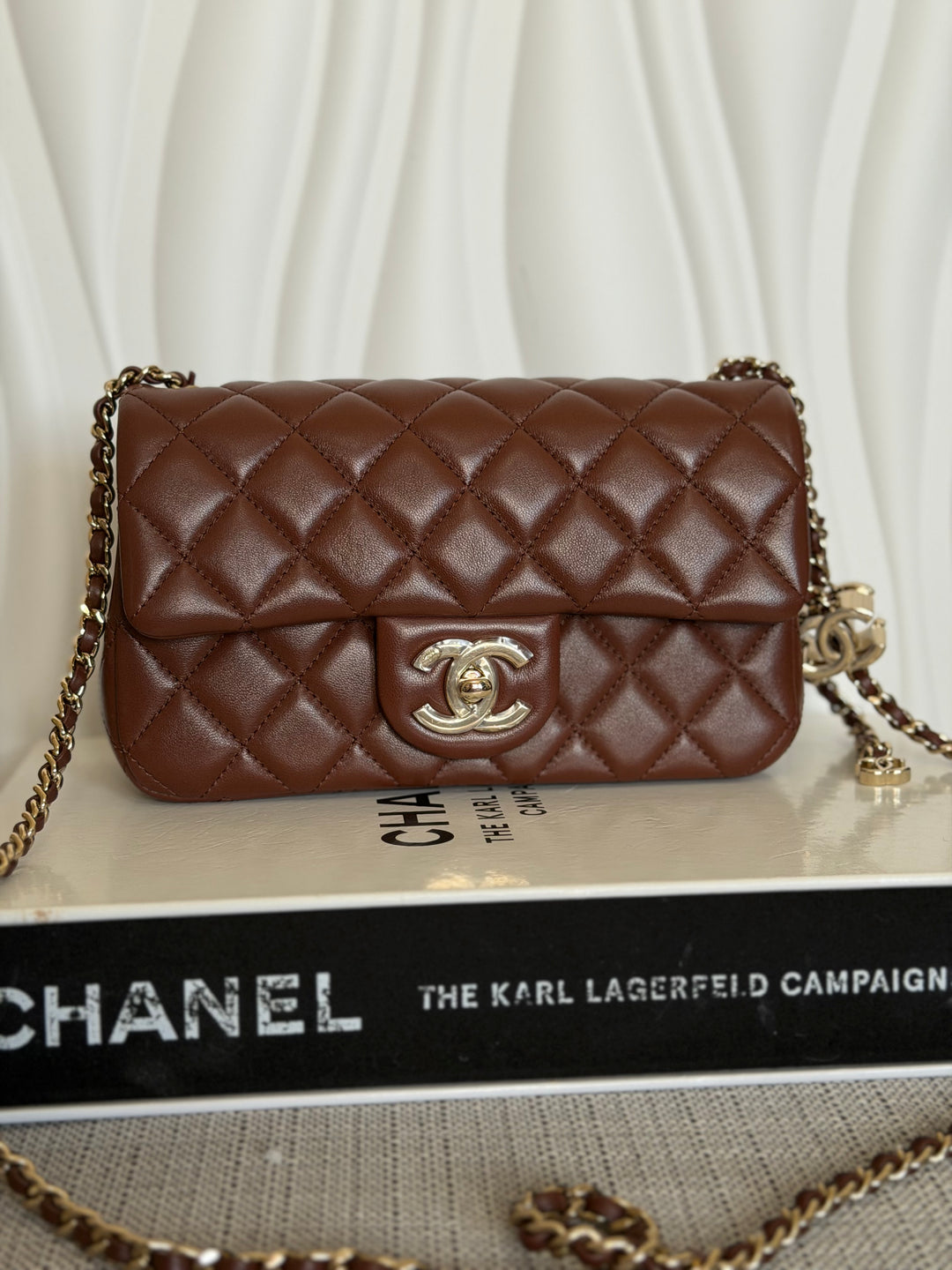 CHANEL 26S Brown Lambskin Adjustable Chain LGHW Mini Rectangular Flap Bag 2026