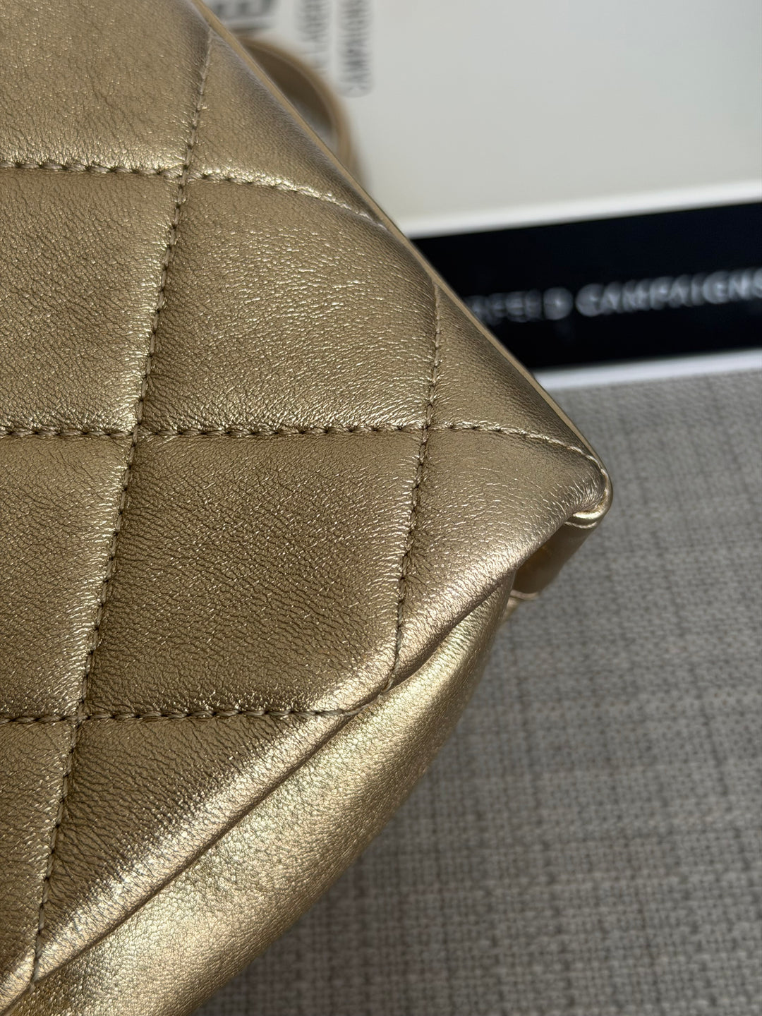 CHANEL Gold Metallic Lambskin CC Crystal Logo Chain Flap Bag 2022
