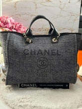 Load image into Gallery viewer, Chanel 2021 Deauville tote in Black interwoven raffia like material with LGHW in size Medium Tote Bag (15 inches)
