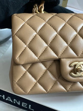 Load image into Gallery viewer, Chanel 22B 2022 Fall/Winter collection Dark Beige Lambskin Top Handle with gold metal plate and antique GHW Mini Rectangular Flap bag

