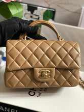 Load image into Gallery viewer, Chanel 22B 2022 Fall/Winter collection Dark Beige Lambskin Top Handle with gold metal plate and antique GHW Mini Rectangular Flap bag
