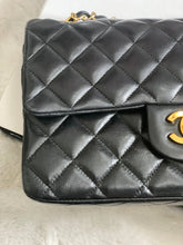 Load image into Gallery viewer, Chanel series 1 (circa 1989-1991) Black Lambskin 24K GHW Small Classic Double Flap Vintage Bag
