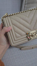 Load and play video in Gallery viewer, Chanel series 26 18A 2018 Fall/Winter Collection Iridescent Light Beige Chevron Caviar Le Boy Flap Bag size Small with Shiny GHW
