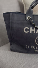 Load and play video in Gallery viewer, Chanel series 21 2015 Denim Deauville Tote with Leather Handle Size Medium (15 inches)
