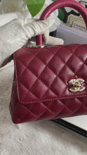 Load and play video in Gallery viewer, Chanel 21A 2021 Fall/Winter collection Burgundy caviar LGHW Coco Handle Flap Bag size Small with detachable Shoulder Strap
