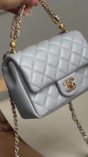 Load and play video in Gallery viewer, CHANEL Pearl Twist Pearly Silver Light Blue Lambskin Mini Flap Bag
