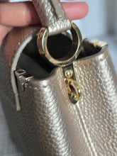 Load image into Gallery viewer, LOUIS VUITTON LV Metallic Taurillon Embellished Flower Crown Mini Capucines in Gold
