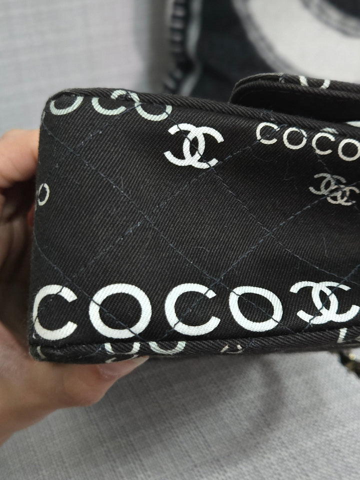 Chanel series 7 2002/2003 Black Canvas Quilted “COCO” Medium Classic Flap Light Gold Hardware