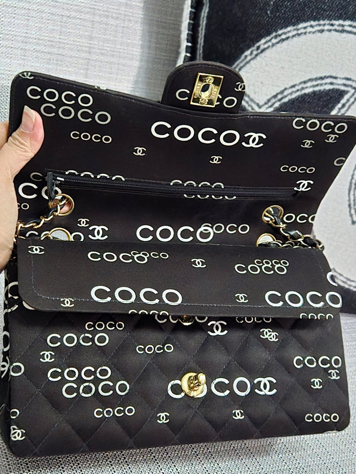 Chanel series 7 2002/2003 Black Canvas Quilted “COCO” Medium Classic Flap Light Gold Hardware
