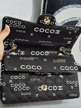 Load image into Gallery viewer, Chanel series 7 2002/2003 Black Canvas Quilted “COCO” Medium Classic Flap Light Gold Hardware
