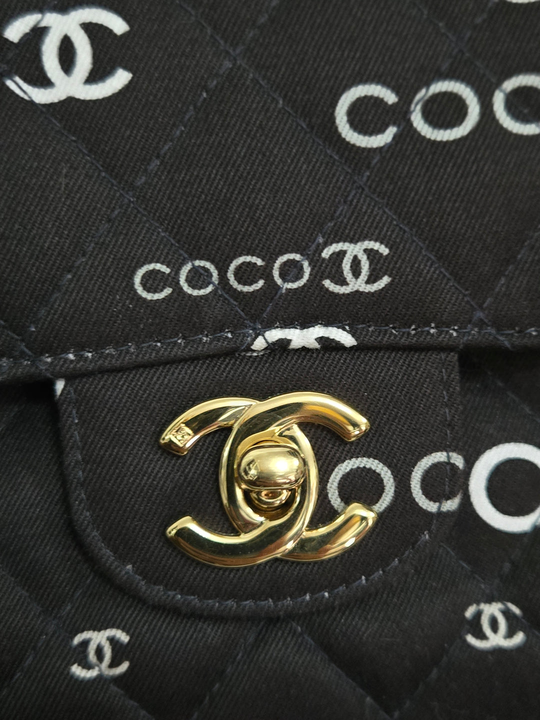 Chanel series 7 2002/2003 Black Canvas Quilted “COCO” Medium Classic Flap Light Gold Hardware