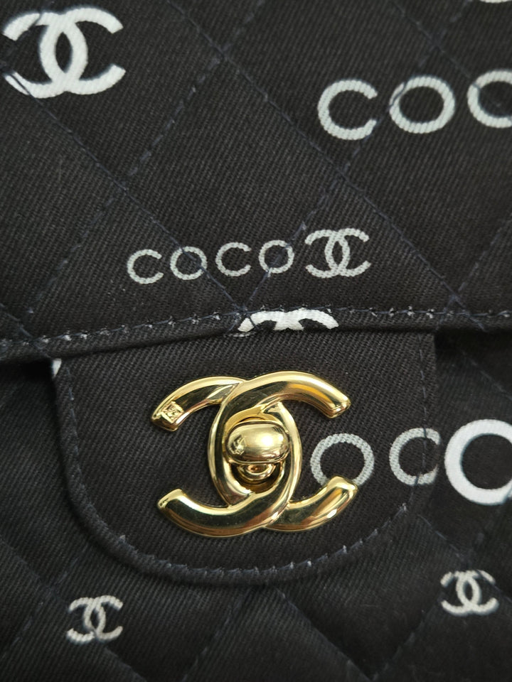 Chanel series 7 2002/2003 Black Canvas Quilted “COCO” Medium Classic Flap Light Gold Hardware