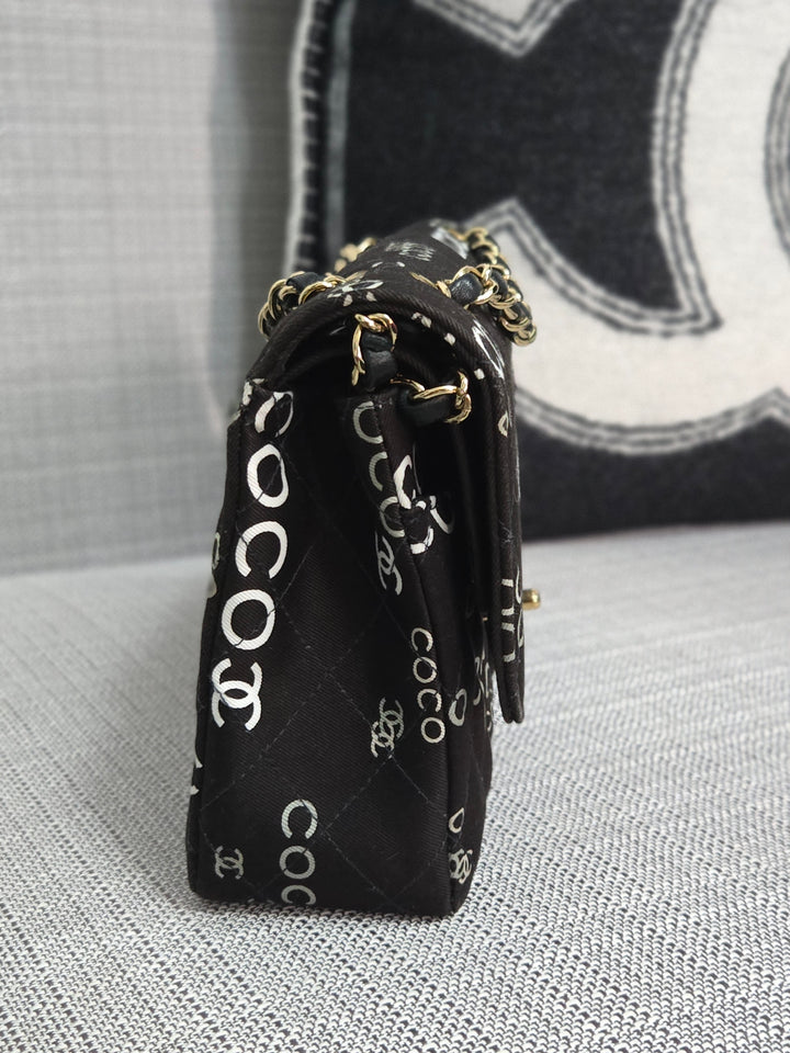 Chanel series 7 2002/2003 Black Canvas Quilted “COCO” Medium Classic Flap Light Gold Hardware